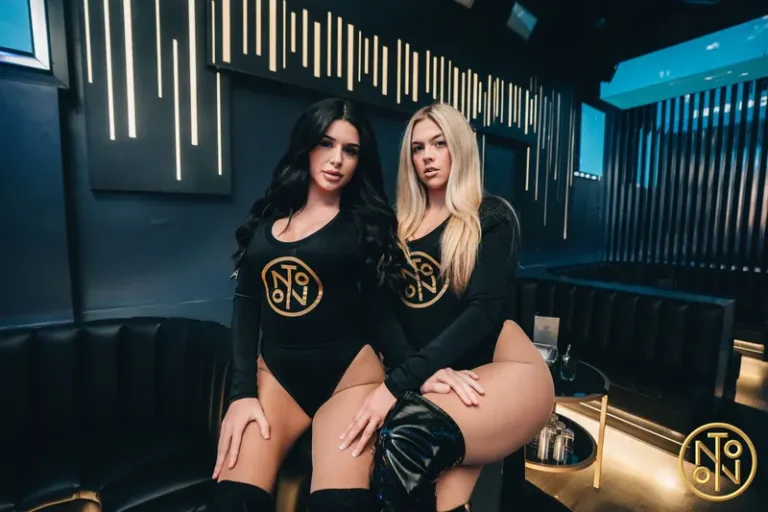 Two girls sitting at noto club